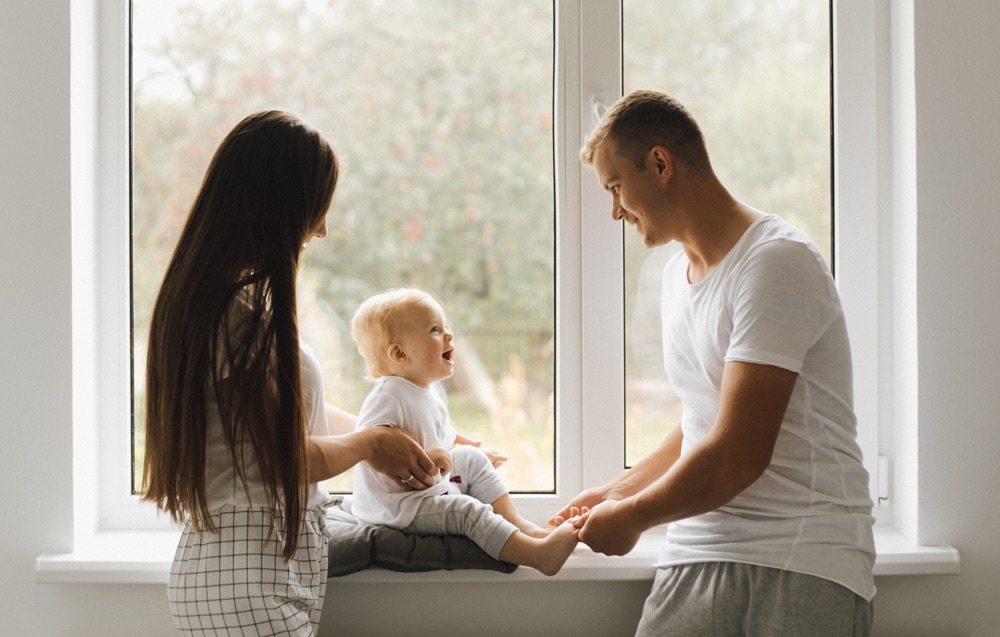 family next to window